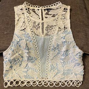 Women's slim fit lace top by LUSH. Size Small.